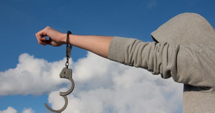 Do You Choose Courage Or Conformity? handcuffed man freed and reaching out into the sky for lfreedom